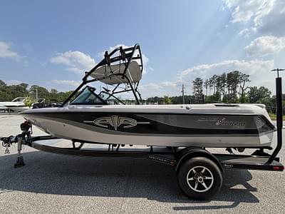 BOATZON | 2003 Nautique Super Air 210 wPCM Excalibur 330HP Engine and Boatmate Trailer Included