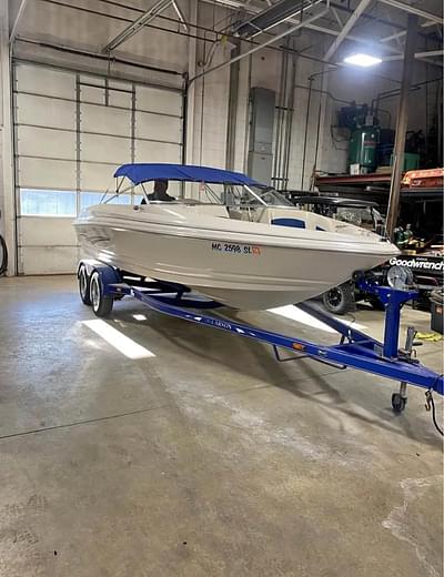 BOATZON | 2002 Larson SEI 210 21ft 5.0l gm motor with a Volvo penta outdrive. very clean boat, has never been left in water no scum lines anywhere. Runs great. Just put a new water pump on, rebuilt carb, engine cover/sun deck reupholstered this year. Has matching larson/E-Z loader trailer 4 brand new tires. Trailer is in great condition