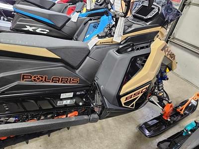 BOATZON | Polaris® 850 RMK Khaos 155 Gloss BlackMilitary TanOrange Burst 2024